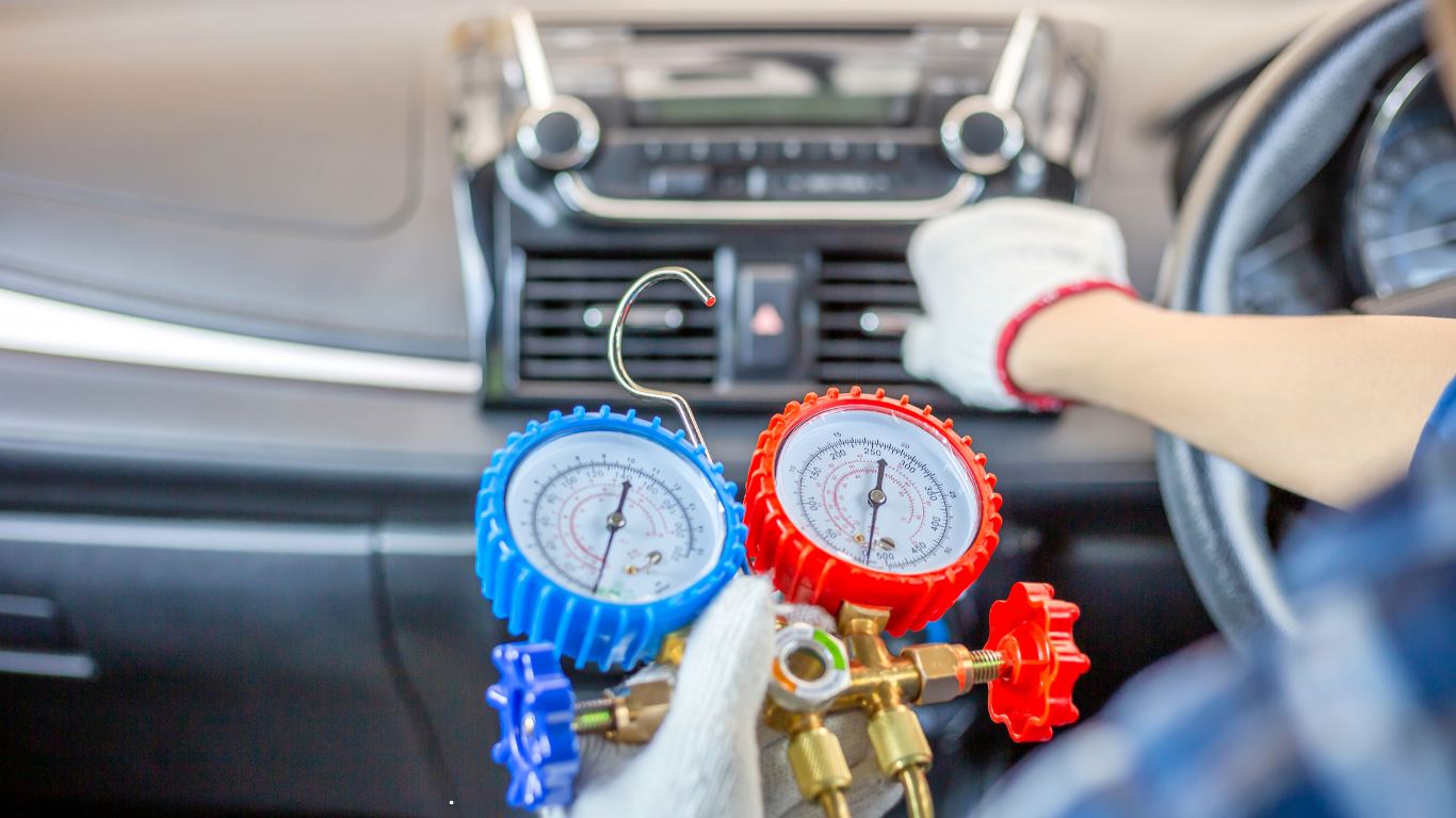 IQ Auto Repair mechanic performing auto AC and heater diagnostics